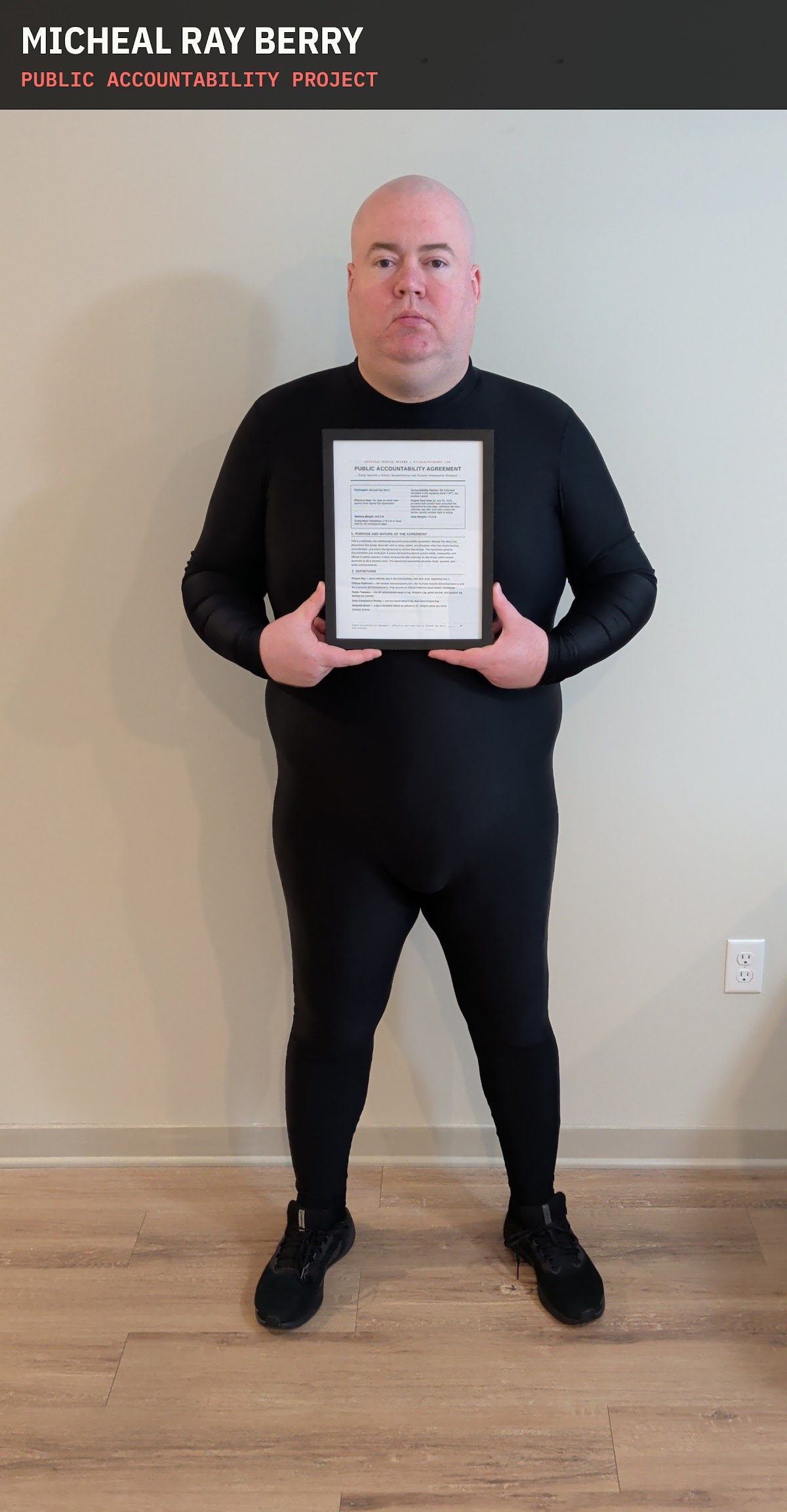 Micheal Ray Berry holding the signed accountability agreement, July 20, 2026