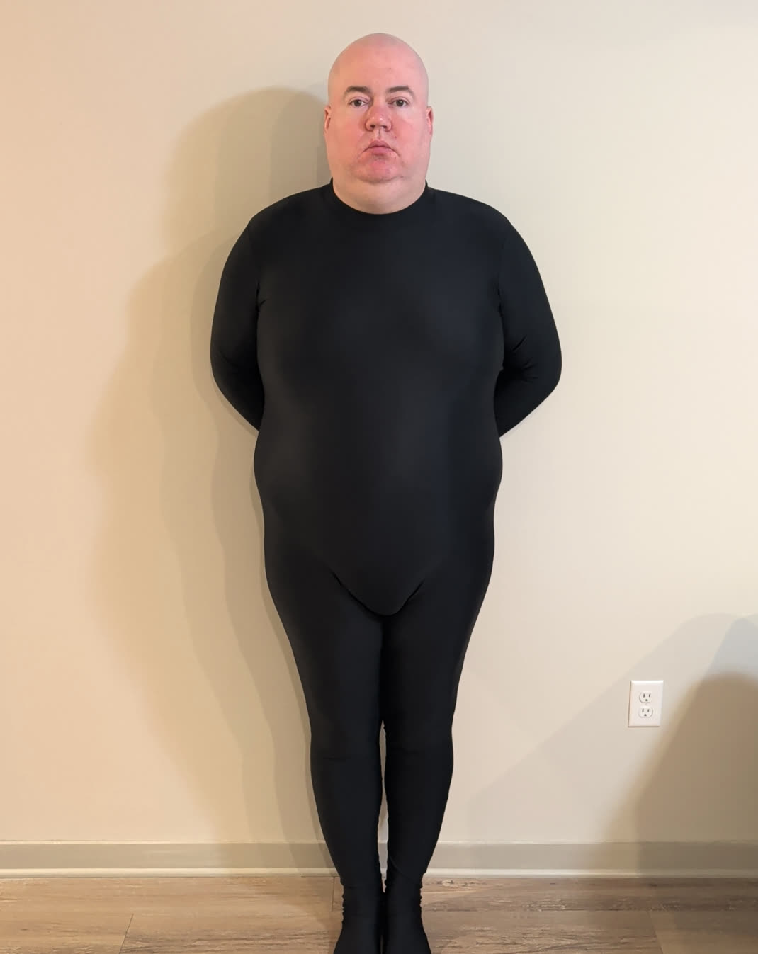 Micheal Ray Berry, standing straight, hands behind his back